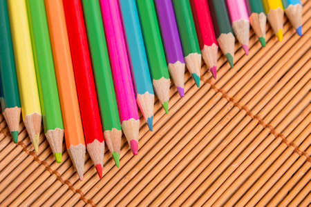 Wooden colorful pencils, on wooden tableの写真素材