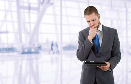 businessman using touch pad of tablet pc, at the officeの写真素材