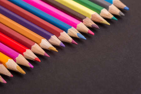 Wooden colorful pencils, on a dark backgroundの写真素材