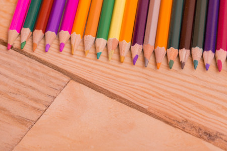 Wooden colorful pencils, on wooden tableの写真素材