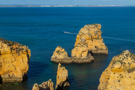 Ponta da Piedade cliffs near Lagos, Portugal. Beautiful seascape with natural rock formations in the Algarve, Portugalの写真素材