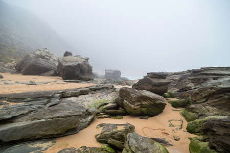 Beautiful empty beach in Alentejo in a foggy day, Portugalの写真素材