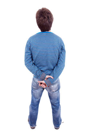 A man in jeans standing on a white background. Isolation, back viewの写真素材