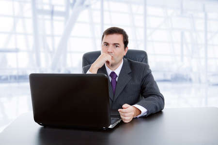young business man working with is laptop, at the officeの写真素材