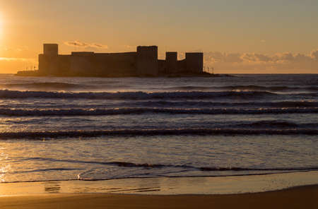 Kizkalesi castle on a small island at sunrise, Kizkalesi Maidens Castle near Mersin, Turkeyの写真素材