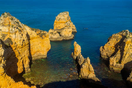 Ponta da Piedade cliffs near Lagos, Portugal. Beautiful seascape with natural rock formations in the Algarve, Portugalの写真素材