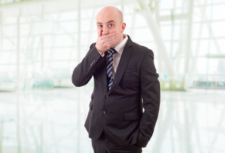 young business man surprised at the officeの写真素材