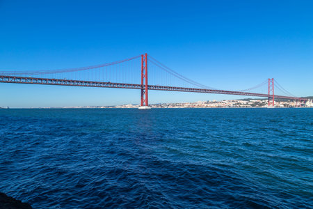 The 25 de Abril Bridge (Ponte 25 de Abril) is a suspension bridge in Lisbon over Tagus river, in Portugal.の写真素材