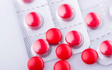 Tablets pills capsule heap mix therapy drugs, over a white backgroundの写真素材