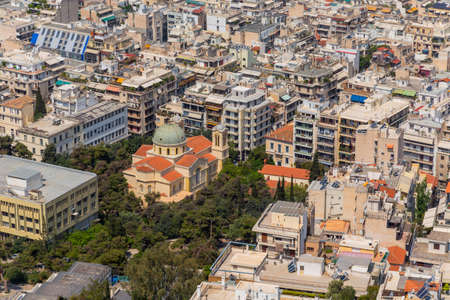 ATHENS, GREECE - MAY 06 2022: Dense living and architecture in Athens, Greece. Residential district with a lot of houses and real estate in the South of Europe.の写真素材