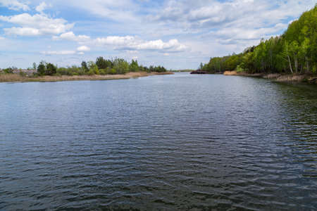 Lake in the town of Prypjat in Ukraine. Lake full of hazardous radioactive waste. after the nuclear disaster of Chernobylの写真素材