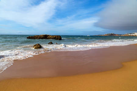 Empty beach in Albufeira. This beach is a part of famous tourist region of Algarve. Portugalの写真素材