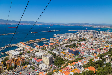 The town and harbour of Gibraltar viewed from up the Rock. Gibraltar is a British Overseas Territory located on the southern of Spain.のeditorial素材