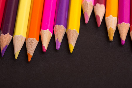 Wooden colorful pencils, on a dark backgroundの写真素材