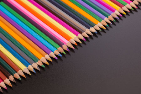Wooden colorful pencils, on a dark backgroundの写真素材