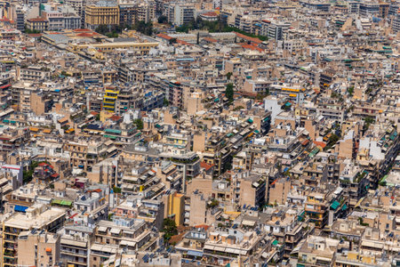 Dense living and architecture in Athens, Greece. Residential district with a lot of houses and real estate in the South of Europe.の写真素材