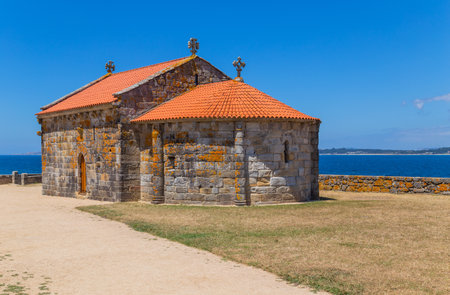 Ermida de Nosa Senora da Lanzada (church of Our Lady of Lanzada) in La Lanzada beach, Galicia, Spain, Europeの写真素材