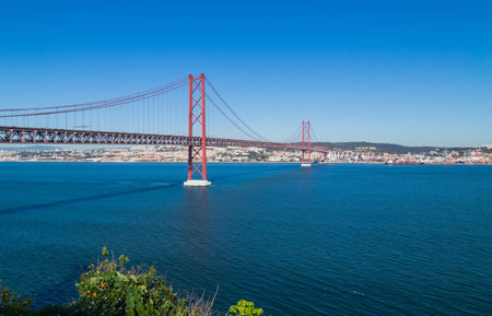 The 25 de Abril Bridge (Ponte 25 de Abril) is a suspension bridge in Lisbon over Tagus river, in Portugal.の写真素材