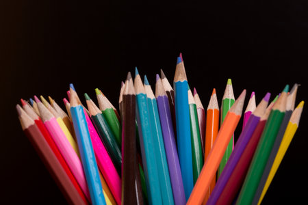 Wooden colorful pencils, on a dark backgroundの写真素材