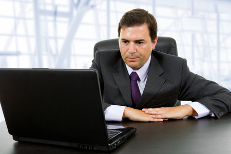 young business man working with is laptop at the officeの写真素材