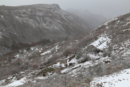 Old houses in ruins in the mountains, lots of snow in the north of Portugalの写真素材