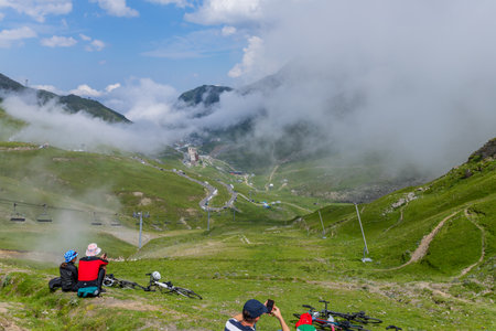 Col du Tourmalet, France - July 06 2023: Cycling fans waiting for the buch at the top of the Col du Tourmalet in Pyerenees mountains during the stage 6 of Le Tour de France 2023のeditorial素材