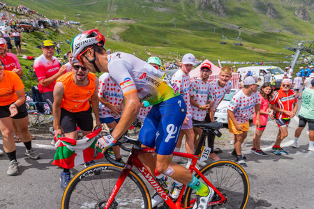 Col du Tourmalet, France - July 06 2023: Valentin Ferron climbig the road to Col du Tourmalet in Pyerenees mountains during the stage 6 of Le Tour de France 2023.のeditorial素材
