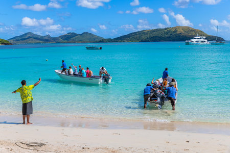 Nacula, Fiji: Tourists at the tropical sandy beach of Nacula island, Yasawa islands, Fiji, South Pacific Islands, Pacificのeditorial素材