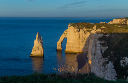 Sunset on the coast in Etretat, France. Etretat is a charming town famous for the stunning cliffs of Etretat on the Alabaster Coastの写真素材