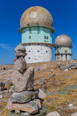 Rocks in Torre and transmitting towers with golden cupola, the highest point of Portugal, in Serra da Estrelaの写真素材