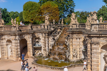 Dresden, Germany: People among the Fariy figures and statues on the Nymphenbad at baroque Zwinger palace.のeditorial素材