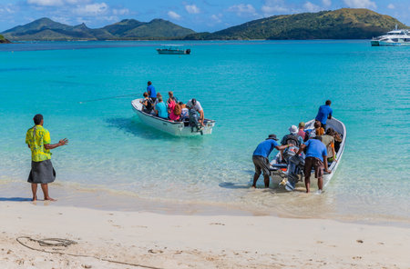 Nacula, Fiji: Tourists at the tropical sandy beach of Nacula island, Yasawa islands, Fiji, South Pacific Islands, Pacificのeditorial素材