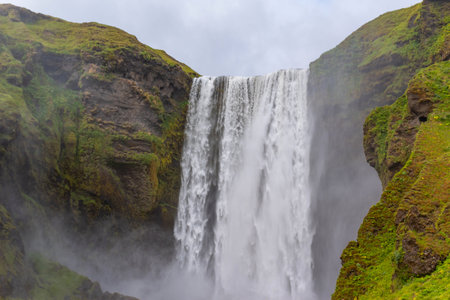 Beautiful Skogafoss waterfall. The most popular destination in Iceland. Water falling down a beautiful valleyの写真素材
