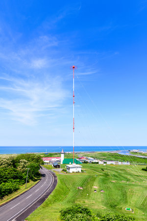 A summer panoramic view from the Fujimigaoka Park Observatory in Enbetsu Town, Teshio District, Hokkaido. Under the clear blue sky, the quiet townscape spreads out before you.の写真素材
