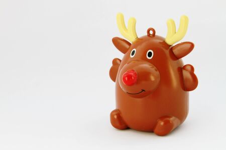Isolate christmas red nose reindeer sitting white backgroundの写真素材