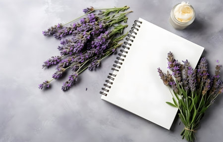 lavender herbs and empty notebook on grey snowy background top viewの素材