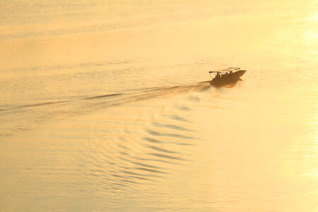 Fisherman on the lakeの写真素材