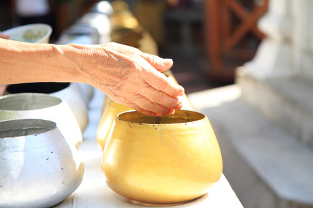 hand of old woman on monk\\の写真素材