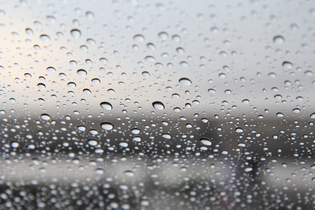 rain fall on glassの写真素材