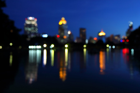 blur light and reflection of the lake in the cityの写真素材