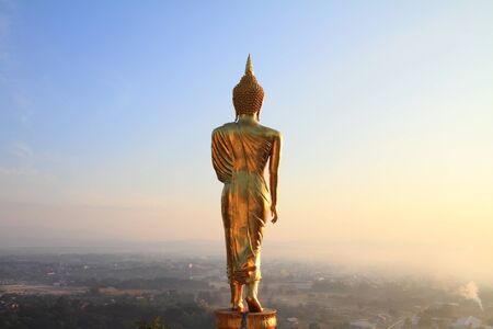 behind Buddha statue before sunrise timeの写真素材