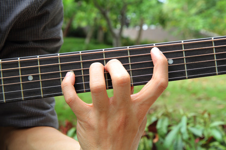 playing guitar in the parkの写真素材