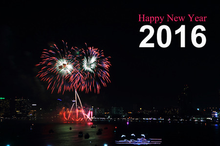 Happy New Year 2016 text and fireworks on background