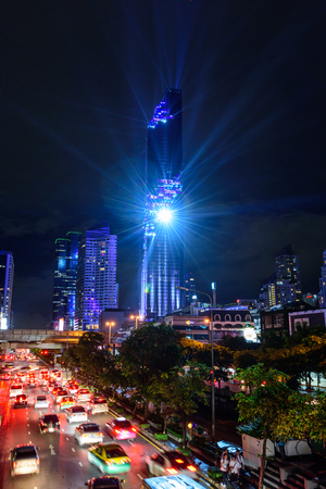 Lighting show at High Tower in the city and blur light moving of the car at the streetのeditorial素材
