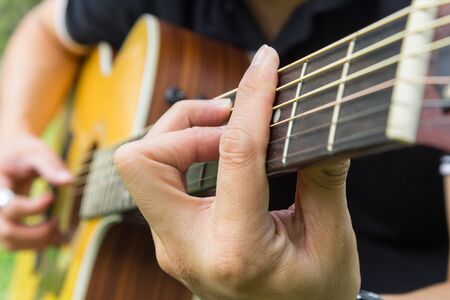 playing guitar in the park