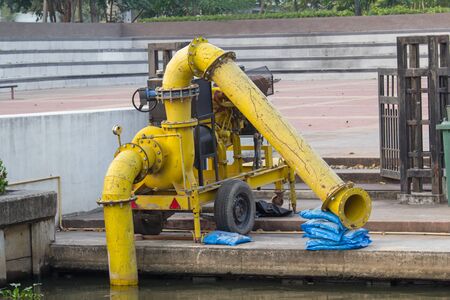 Old Water pump at the riverの写真素材