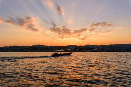 Unidentified traveler boating in the lake with sunligの写真素材