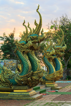 Golden dragon statue at Thai church in Watsirindhornwararamの写真素材