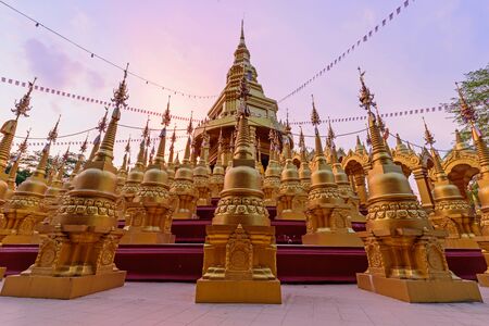 Golden pagoda in WatPaSawangBun Templeの写真素材