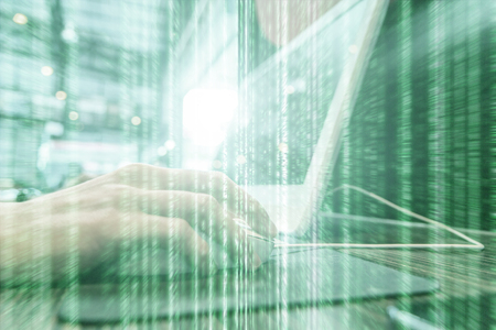 use computer in net cafe and green blur line in foreground